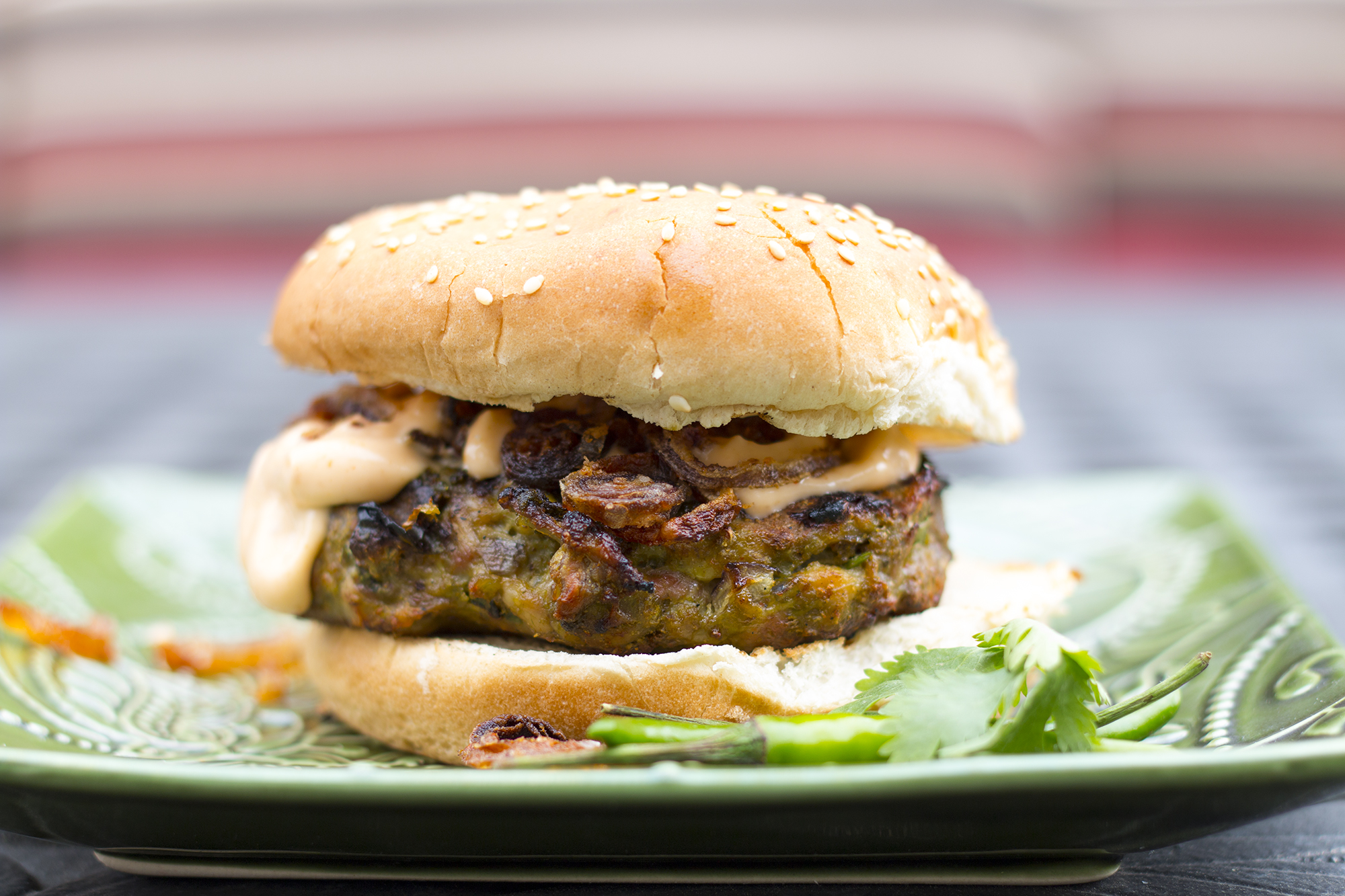 Cilantro & Chilli Chicken Burger With Spiced Fried Onions.